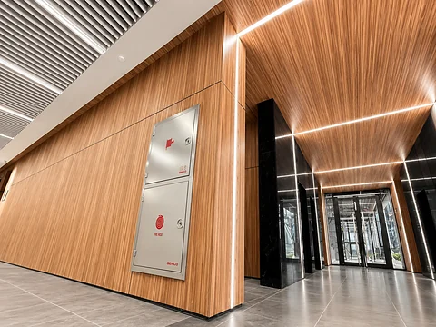 Angled timber wall panel with concealed lighting