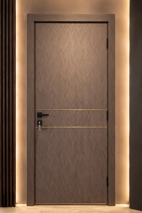 WPC 02 Chevron Gold door installed with concealed cove lighting