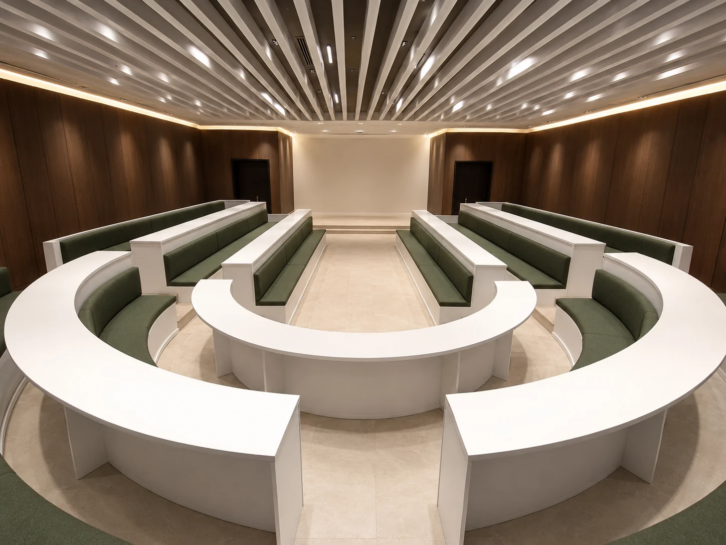 Completed council chamber with tiered seating and walnut wall panelling