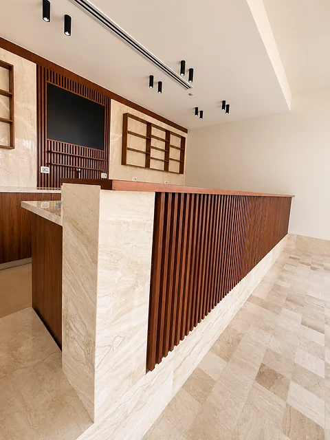 Timber service desk with display shelving behind