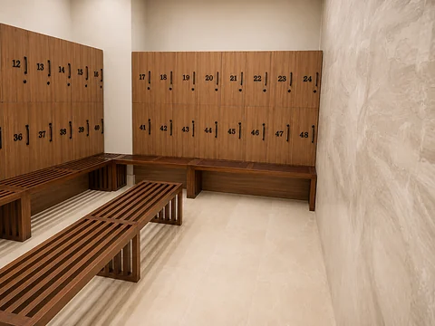 Timber locker wall with slatted bench in a changing area